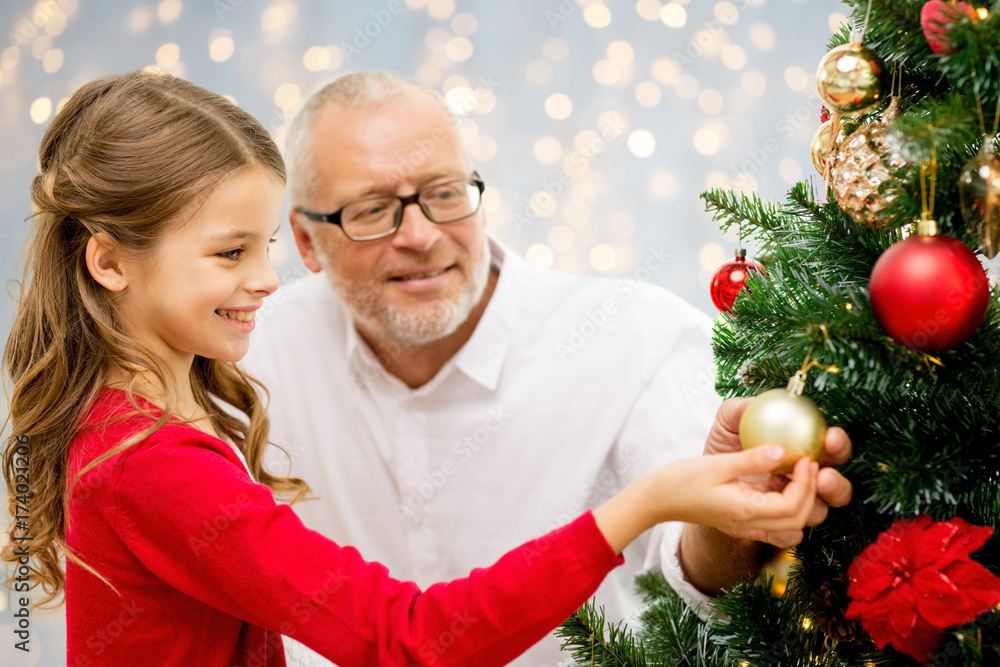 grandfather and granddaughter at christmas tree grandfather and granddaughter at christmas tree