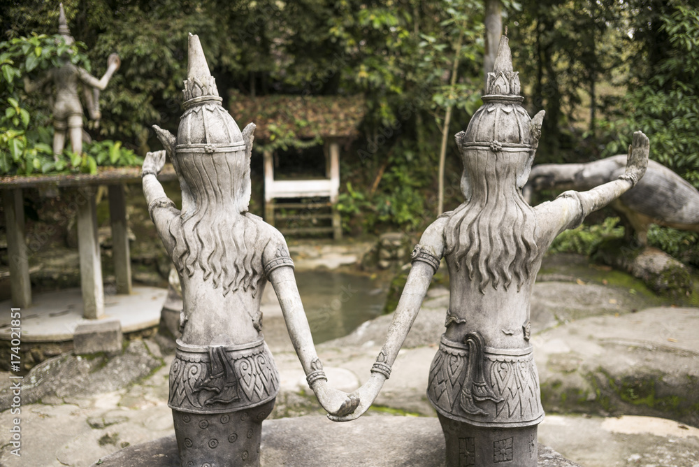 Rear view of two statues in Heaven's Garden, Koh Samui, Surat Thani Province, Thailand Rear view of two statues in Heaven's Garden, Koh Samui, Surat Thani Province, Thailand