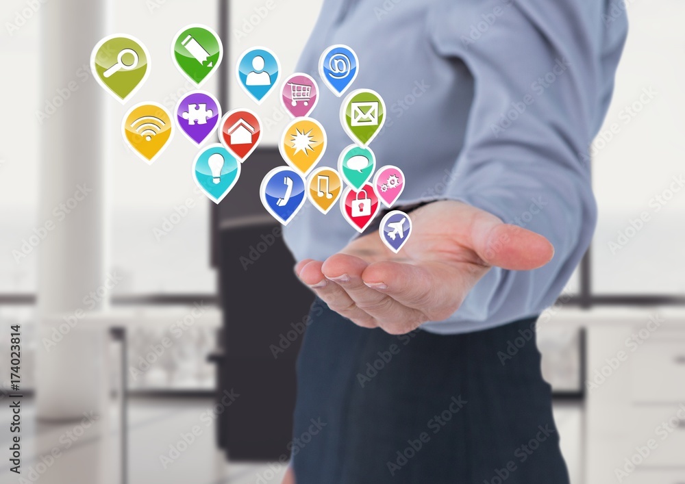 woman with hand spread of with application icons coming up form woman with hand spread of with application icons coming up form