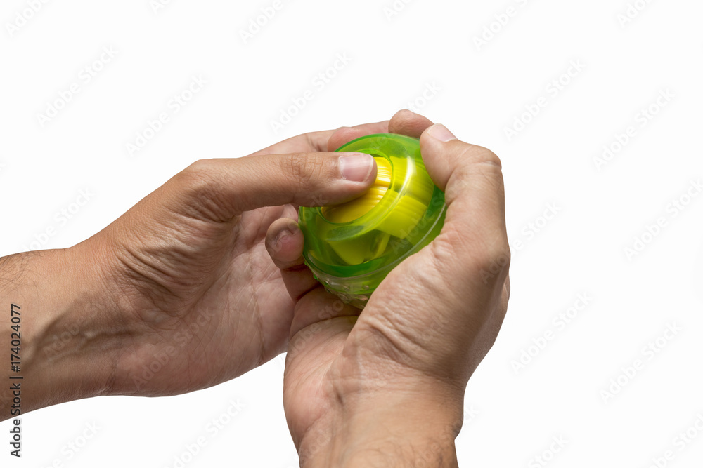 Hands Using Gyroscopic Ball For Exercise, Isolated On White Background Hands Using Gyroscopic Ball For Exercise, Isolated On White Background