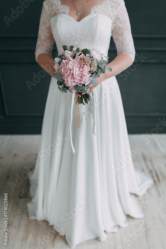 the bride s bouquet of peonies and roses  asymmetrical and modern