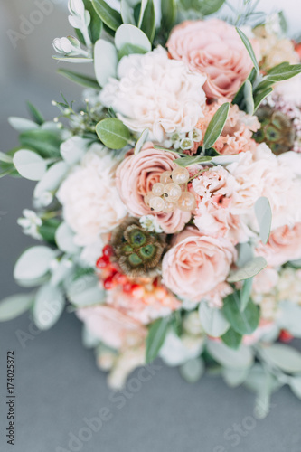 the bride s bouquet of peonies and roses  asymmetrical and modern