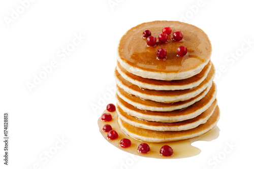 Pancakes with maple syrup and cranberries isolated on a white background. Breakfast, snacks, sweets. Dessert food. Pancakes Day. Shrove Tuesday.