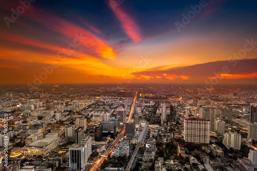 Colorful cityscape in sunset light. Bangkok, Thailand. Aerial view. Dramatic and picturesque evening scene. © Goinyk