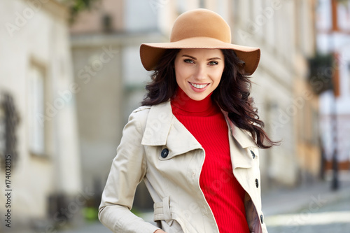 Beautiful woman in autumn style in town. Fashionable concept