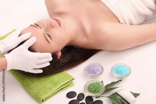 Beautiful Young Woman Getting a Face Treatment at Beauty Salon.