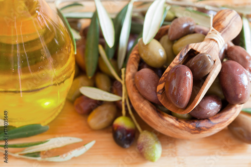 olives on wooden background, kalamata, kalamon, green olives photo