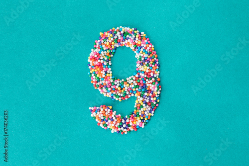 The number nine built from nonpareils photo