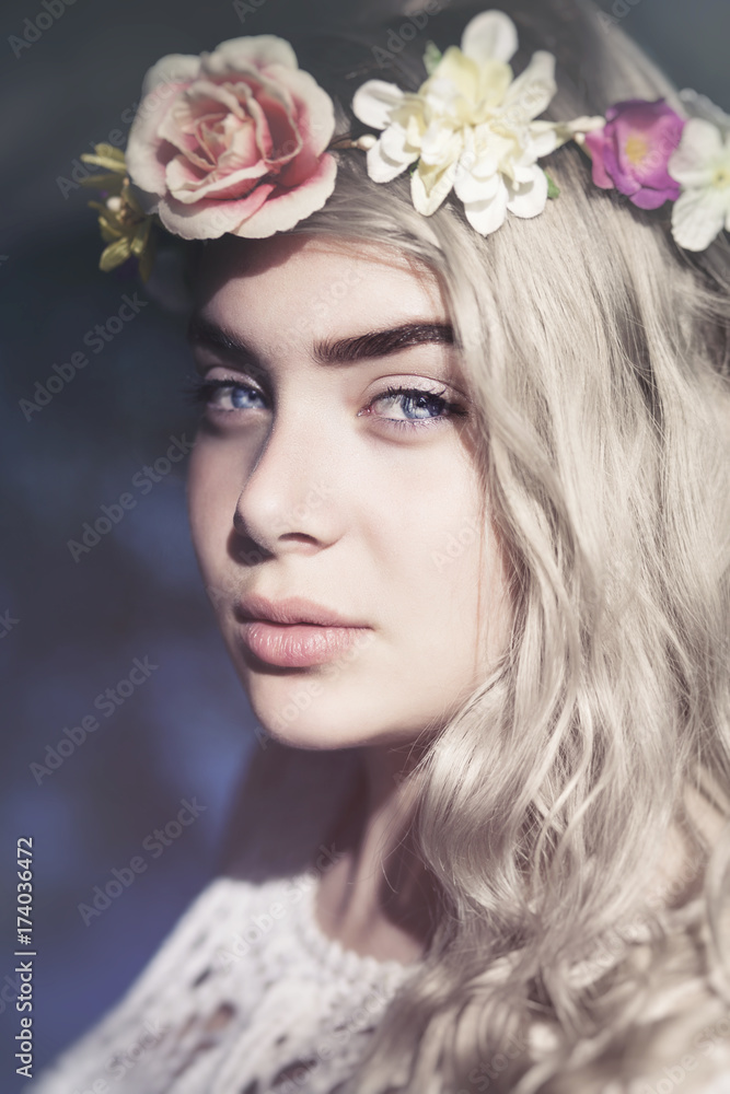 Young beautiful woman with grey hair and blue eyes with flower wreath Young beautiful woman with grey hair and blue eyes with flower wreath
