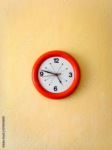 Wallpaper Mural Orange clock on yellow wall Torontodigital.ca