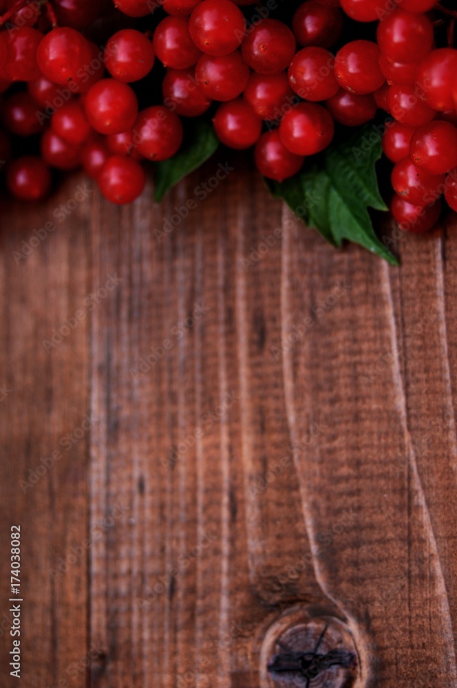 red viburnum on a wooden table red viburnum on a wooden table