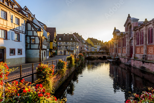Beautiful view of the historic town of Colmar, also known as Little Venice, boat ride along traditional colorful houses on idyllic river Lauch in summer, Colmar, Alsace, France