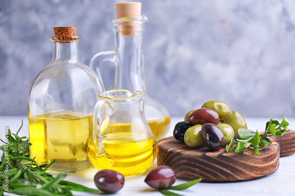 Composition with healthy olives and oil on kitchen table Composition with healthy olives and oil on kitchen table