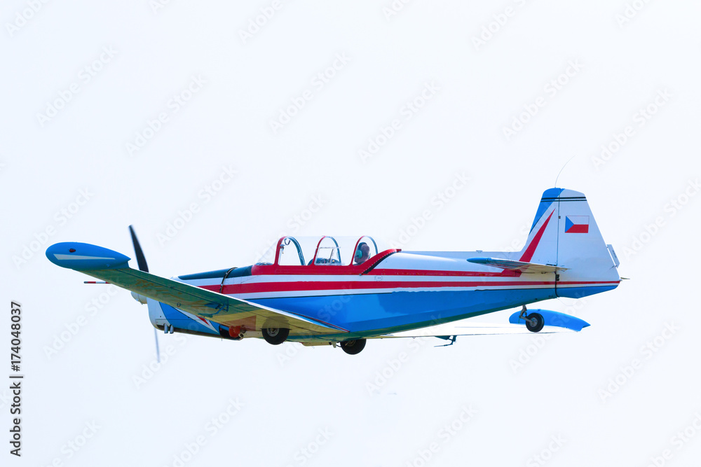 Propeller plane in flight in sky in sunny day, Prague Propeller plane in flight in sky in sunny day, Prague