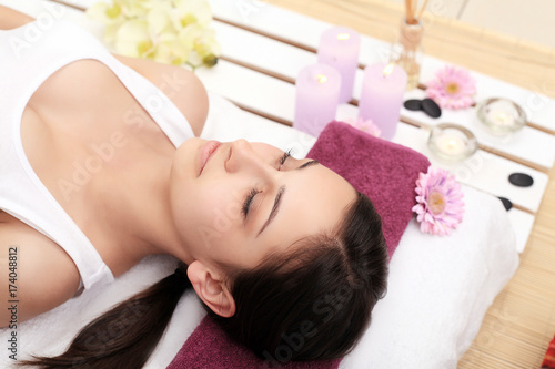 Body Care. Spa Woman. Beauty Treatment Concept. Beautiful Healthy Caucasian Girl Relaxing On Massage Table Before Hand Massage On Relaxed Back In Health And Spa Salon. Skin Care, Wellness, Lifestyle