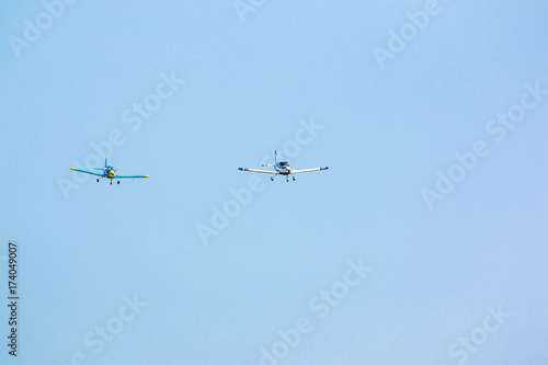Two Propeller planes in flight in sky in sunny day, Prague