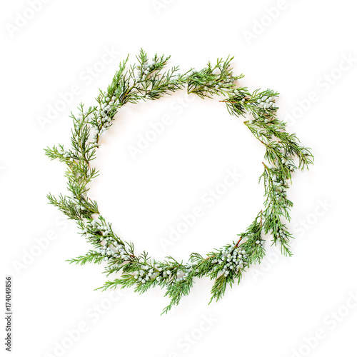 Christmas round frame made of winter evergreens