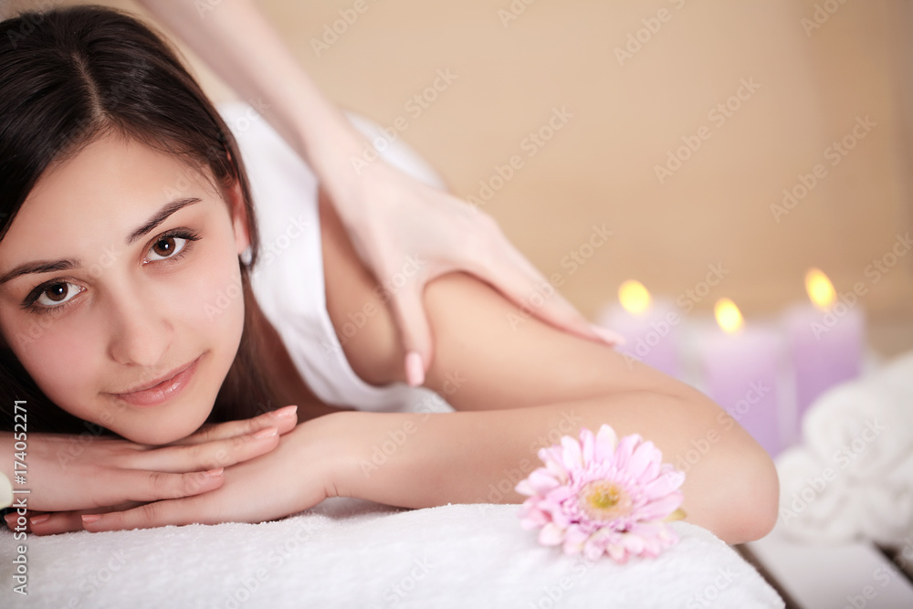 Masseur doing massage on woman body in the spa salon. Beauty treatment concept. Masseur doing massage on woman body in the spa salon. Beauty treatment concept.