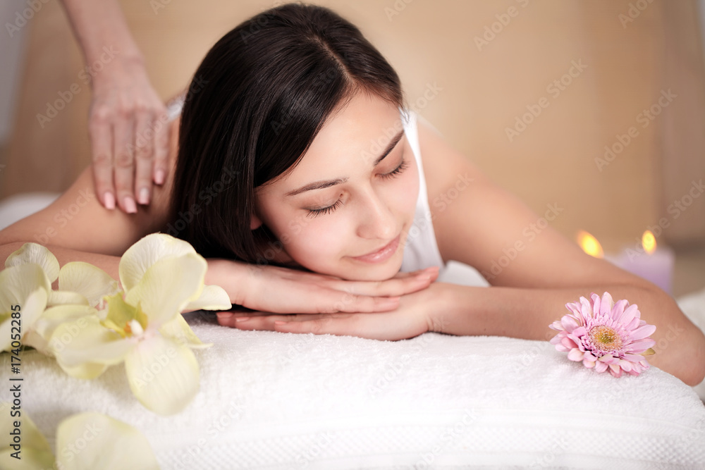 people, beauty, spa, healthy lifestyle and relaxation concept - close up of beautiful young woman lying with closed eyes and having face or head massage in spa people, beauty, spa, healthy lifestyle and relaxation concept - close up of beautiful young woman lying with closed eyes and having face or head massage in spa