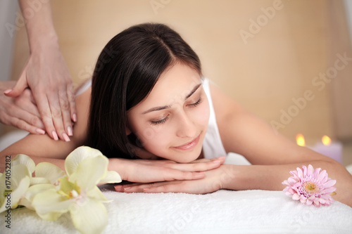 people  beauty  spa  healthy lifestyle and relaxation concept - close up of beautiful young woman lying with closed eyes in spa