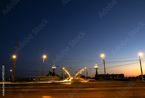 Obraz na płótnie Stone Bridge through Daugava Riga at night by  light of lamps