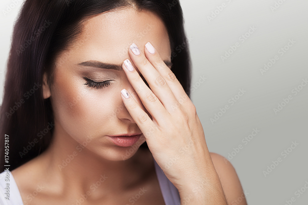 pain. Unhappy, frustrated girl. Bullish appearance. Wonders of migraine or headache. After serious stress. The concept of health. Beautiful young woman. pain. Unhappy, frustrated girl. Bullish appearance. Wonders of migraine or headache. After serious stress. The concept of health. Beautiful young woman.