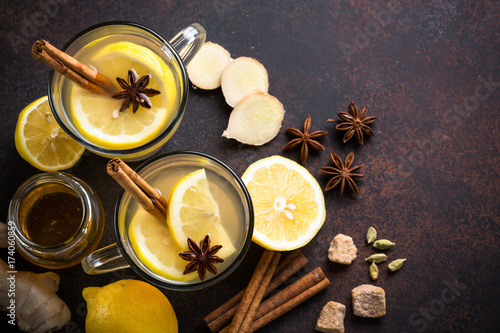 Autumn hot tea with ginger, lemon, honey and spices. Top view.