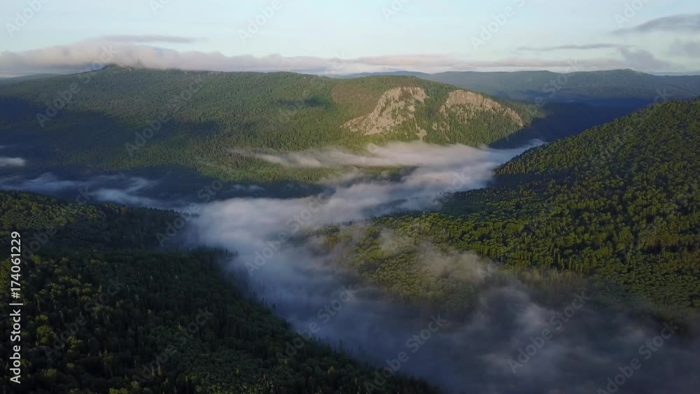 Sunset in the Ural mountains in Karatash ridge. Flying by drone Sunset in the Ural mountains in Karatash ridge. Flying by drone