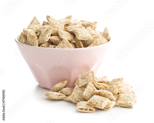 Breakfast cereal squares in bowl.