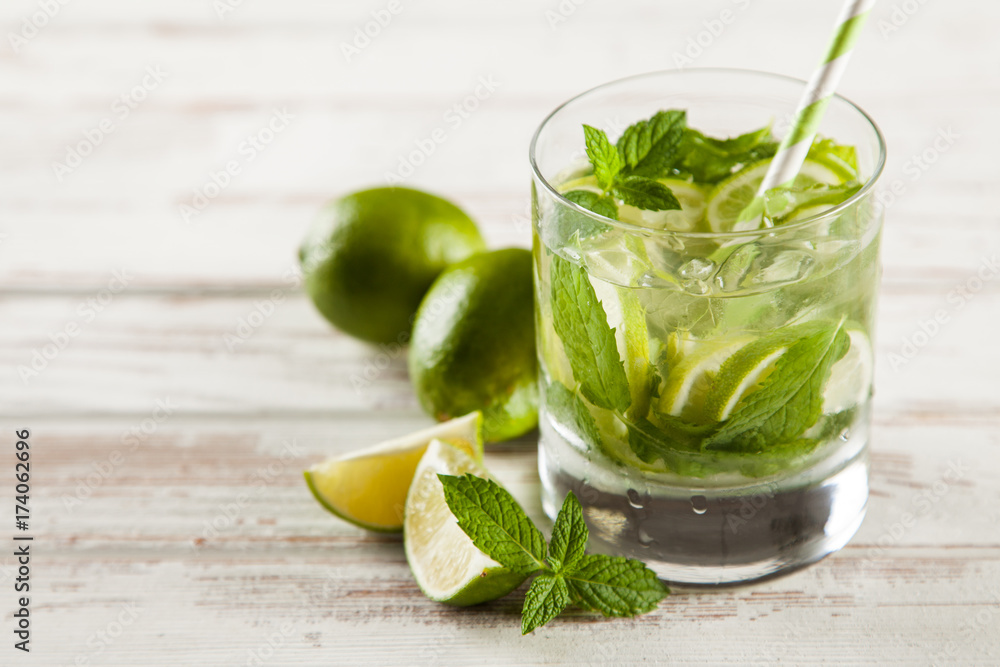 Mojito cocktail on white wood background Mojito cocktail on white wood background