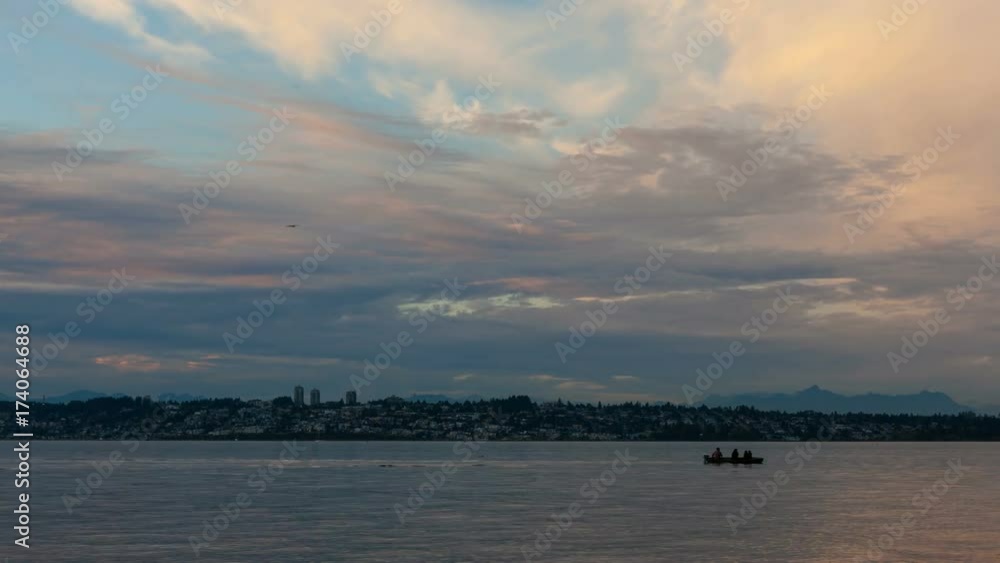 Timelapse movie of moving clouds and sky over White Rock BC Canada from Semiahmoo Bay in Blaine, Washington at sunset 4k uhd