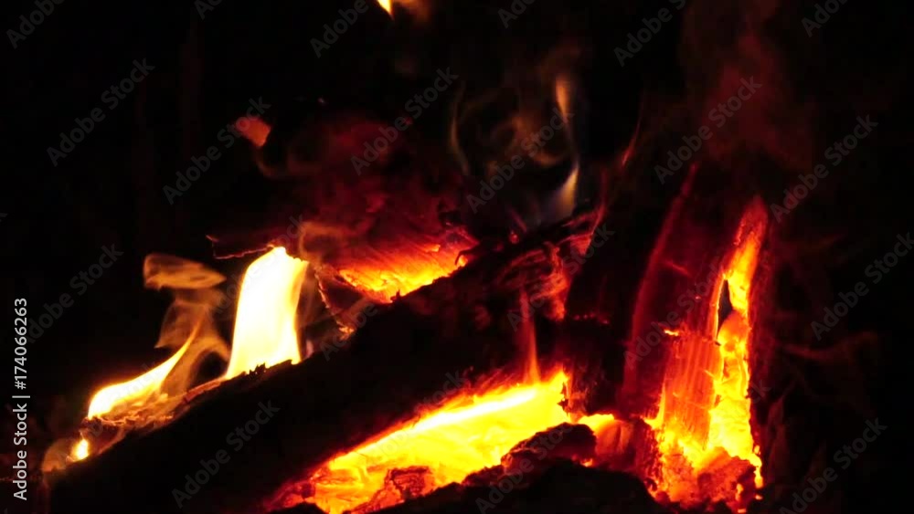 Slow motion. Bonfire. Burning wood on the yard. Close up view. Long shot Slow motion. Bonfire. Burning wood on the yard. Close up view. Long shot