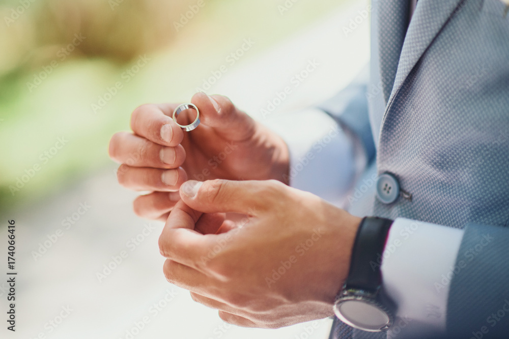 Newly wed couple's hands with wedding rings. Newlyweds put wedding wedding gold rings. Bride and groom's hands with wedding rings