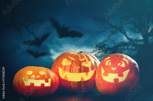 Three halloween Jack O' Lantern pumpkins