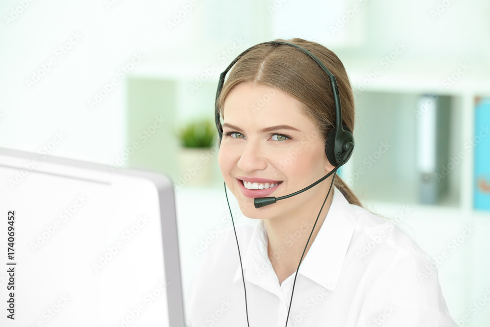 Young female technical support dispatcher working in office Young female technical support dispatcher working in office