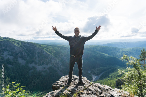 Man stay in a peak in Ural mountains