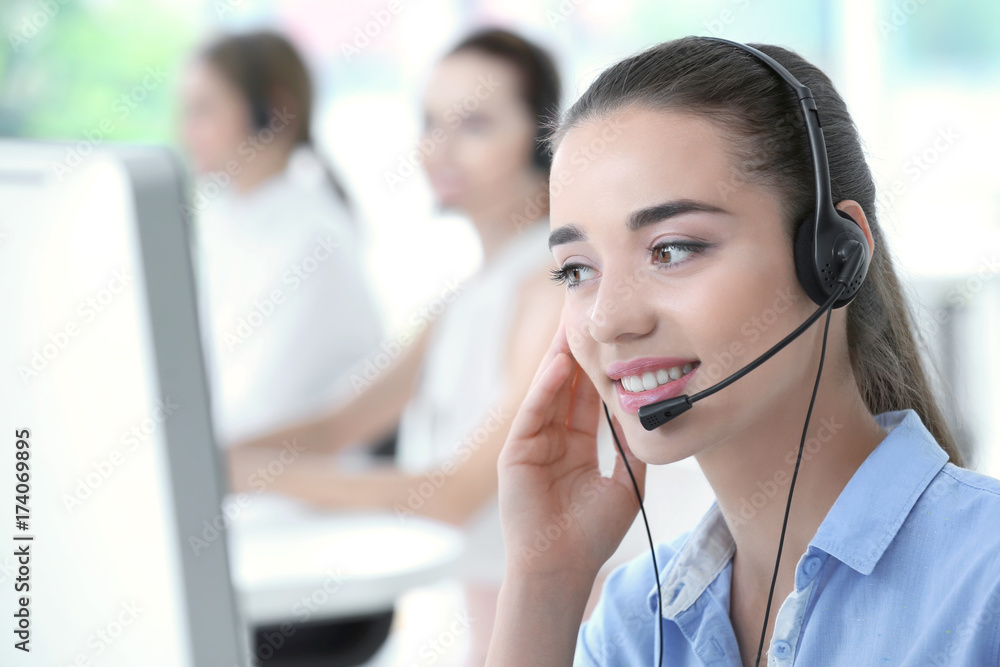 Young female technical support dispatcher working in office Young female technical support dispatcher working in office