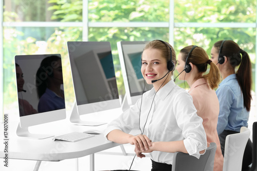 Young female technical support dispatchers working in office