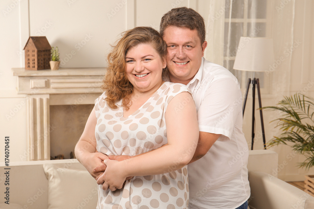 Overweight couple at home Overweight couple at home