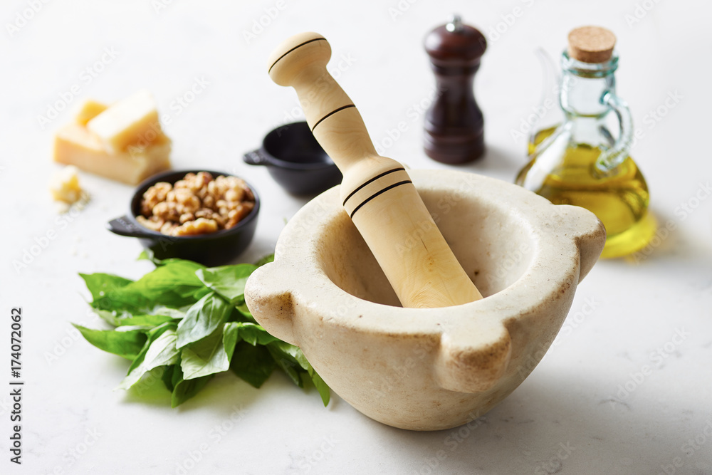 Fresh pesto ingredients with mortar and pestle Fresh pesto ingredients with mortar and pestle