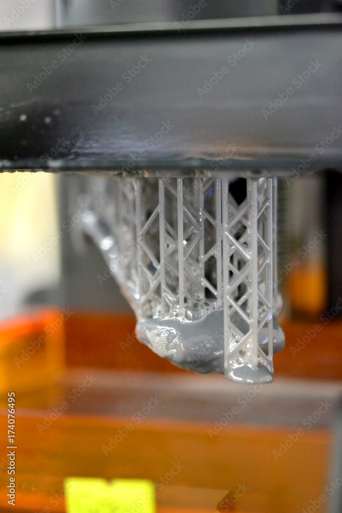 Stereolithography DPL 3d printer create detail and liquid drips, platform  slowly move with liquid close-up. Progressive modern additive technology 3D  printing, create scaled model by UV polymerization Stock Photo | Adobe Stock