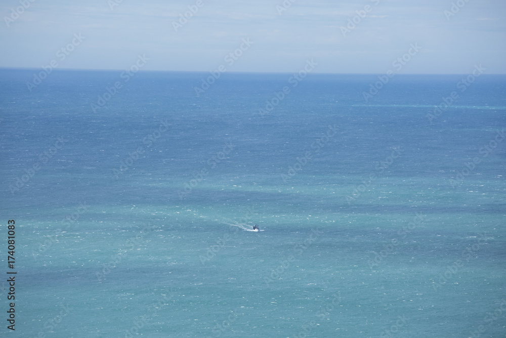 Boat in Blue Ocean