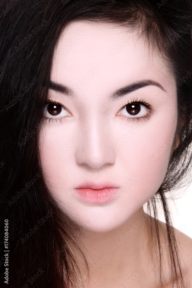 Close-up portrait of beautiful Asian girl with porcelain skin make-up Close-up portrait of beautiful Asian girl with porcelain skin make-up