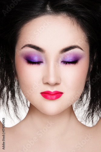 Close-up portrait of beautiful Asian girl with stylish make-up