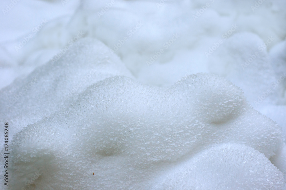 Winter landscape with deep snowdrifts in the frosty morning. White fresh snow lying in deep snowdrifts after the last snowfall. Fresh blue snow close-up in winter season. Winter landscape with deep snowdrifts in the frosty morning. White fresh snow lying in deep snowdrifts after the last snowfall. Fresh blue snow close-up in winter season.