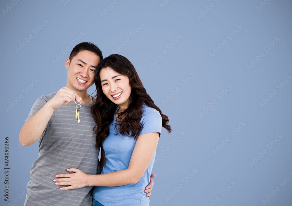 Couple Holding key in front of vignette Couple Holding key in front of vignette