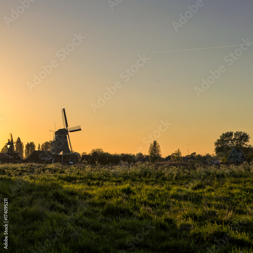Travel Ideas and Concepts.TLine of Traditional Dutch Windmills in the Village of Zaanse Schans, in the Netherlands.