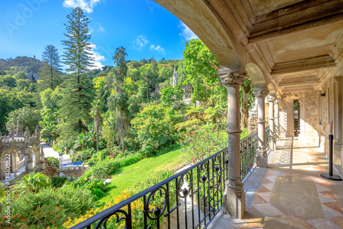 Veranda of Regaleira Palace and beautiful landscape in Sintra  Portugal. Sunny day  blue sky.