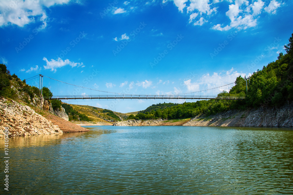 Uvac, Serbia august 03, 2017: Landscape with pedestrian bridge at river Uvac gorge