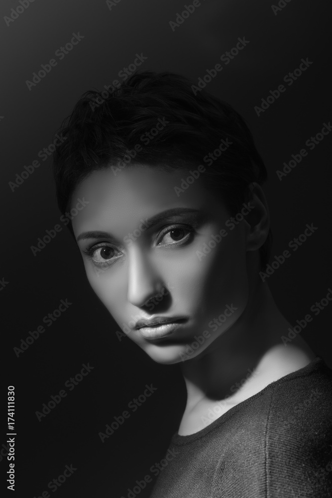 portrait of beautiful sensual woman looking at camera on dark background
portrait of beautiful sensual woman looking at camera on dark background